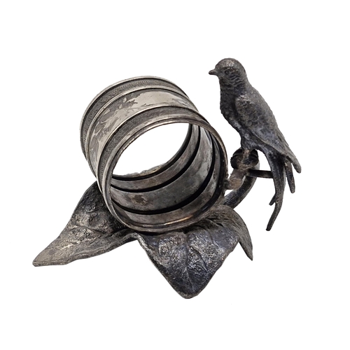 153 - Set of three Meriden Britannia silver plate napkin rings mounted by parrots on lilypads, 8cm high (3... 