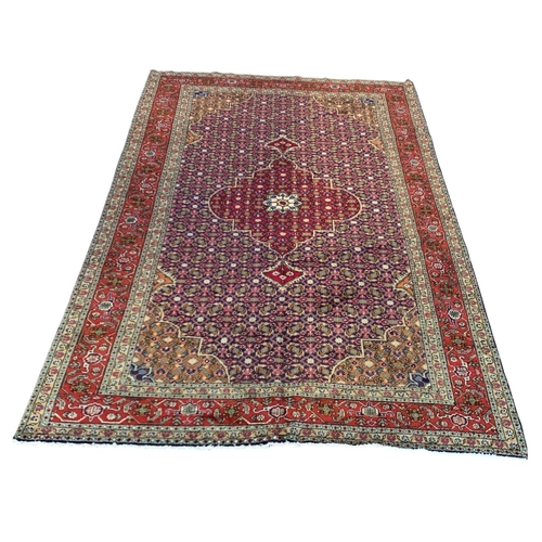 1728 - Good quality Sarouk rug, with intricate floral design, red ground, 300cm x 195