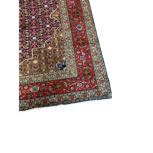 1728 - Good quality Sarouk rug, with intricate floral design, red ground, 300cm x 195