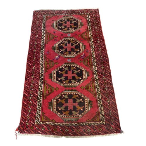 1729 - Kazak four medallion runner, red ground, 185cm x 100cm