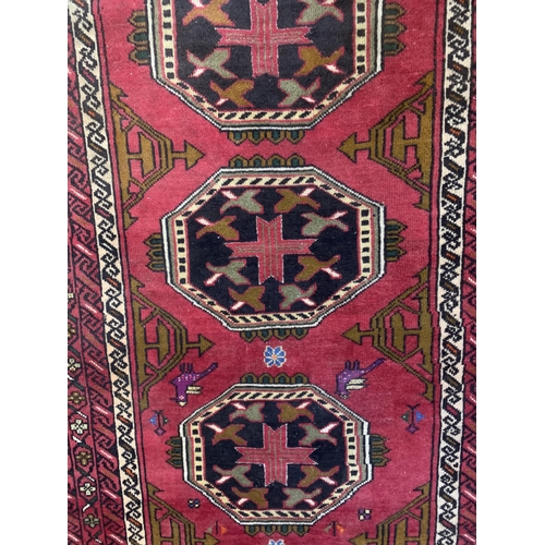 1729 - Kazak four medallion runner, red ground, 185cm x 100cm