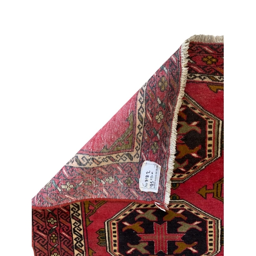 1729 - Kazak four medallion runner, red ground, 185cm x 100cm