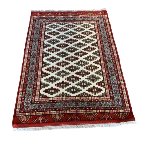 1731 - Khorasan rug, geometric design, red and cream base, 200cm x 125cm