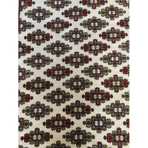 1731 - Khorasan rug, geometric design, red and cream base, 200cm x 125cm