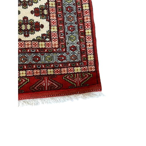 1731 - Khorasan rug, geometric design, red and cream base, 200cm x 125cm