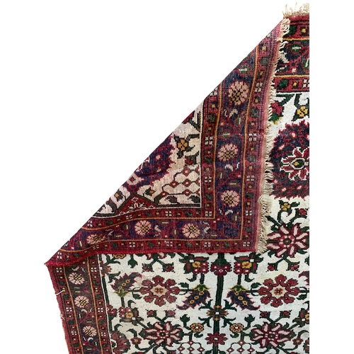 1734 - Attractive Afghan rug with floral design, 270cm x 185cm