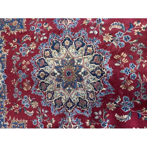 1736 - Good Hamadan carpet with central floral design, red ground 300cm x 295cm