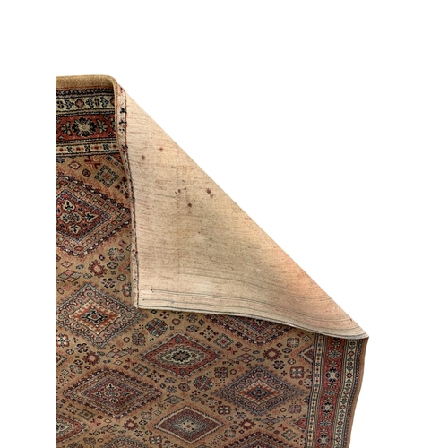 1737 - Belgian Bokhara type rug, with geometric design, mustard ground, 270cm x 225cm