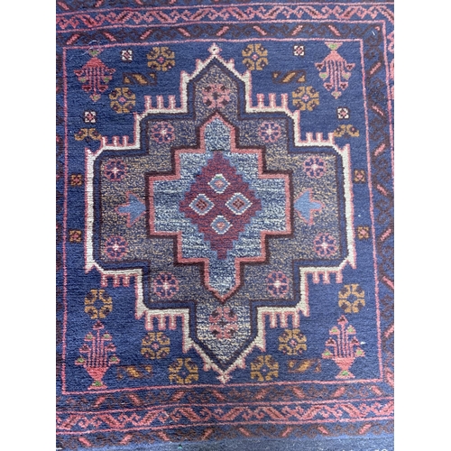 1743 - Unusual single medallion Persian rug with hand knotted fringe, 135cm x 90cm