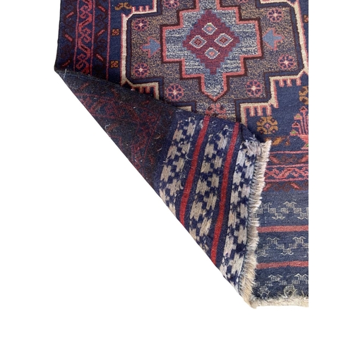 1743 - Unusual single medallion Persian rug with hand knotted fringe, 135cm x 90cm