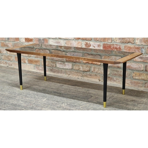 1442 - Vintage teak coffee table raised on ebonised legs, H 42cm x W 129cm x D 46cm