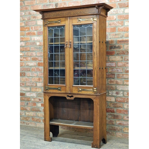 1429 - Arts and Crafts oak bookcase in the manner of Liberty & Co, with lead glazed doors and copper strap ... 