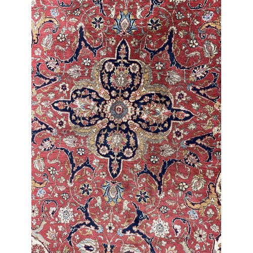 1756 - Persian Mashhad rug, intricate design, red ground, 260cm x 170cm