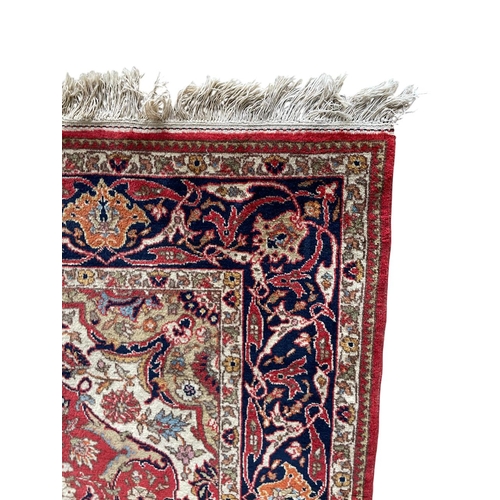 1756 - Persian Mashhad rug, intricate design, red ground, 260cm x 170cm