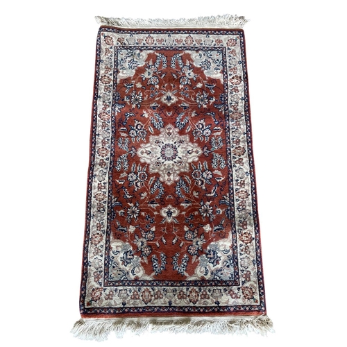 1758 - Keshan rug, floral design, burnt red ground, 125cm x 70cm