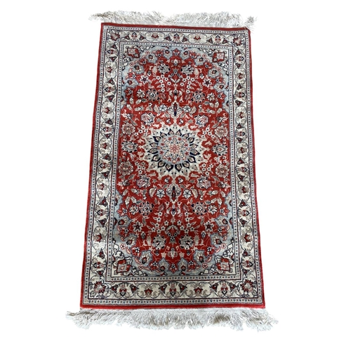 1760 - Keshan rug, floral design, deep red ground, 120cm x 70cm