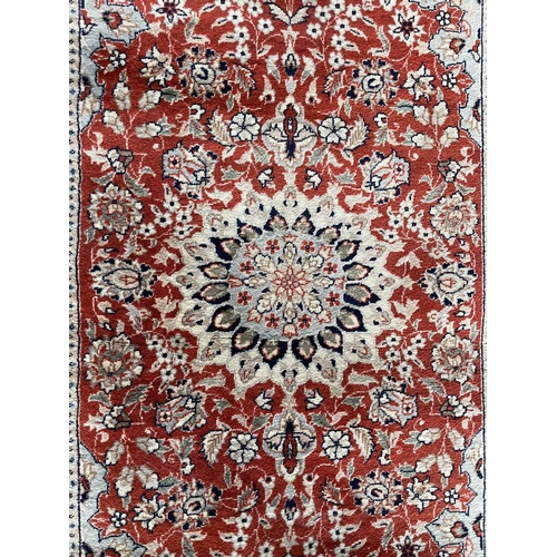 1760 - Keshan rug, floral design, deep red ground, 120cm x 70cm