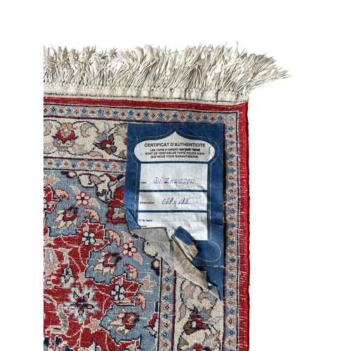 1760 - Keshan rug, floral design, deep red ground, 120cm x 70cm