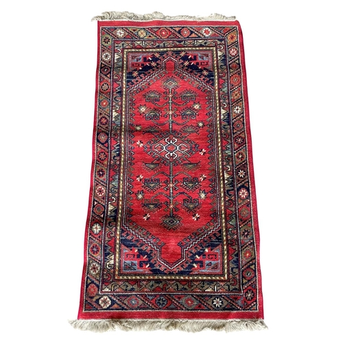 1762 - Kurdish runner, floral medallion, red ground,  70cm x 90cm