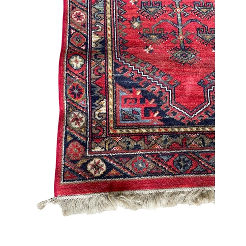 1762 - Kurdish runner, floral medallion, red ground,  70cm x 90cm