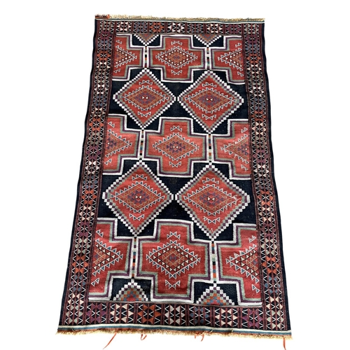 1768 - Sumak rug, medallion design, 210cm x 125cm