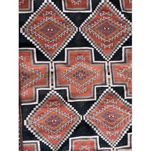 1768 - Sumak rug, medallion design, 210cm x 125cm