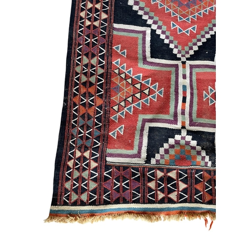 1768 - Sumak rug, medallion design, 210cm x 125cm