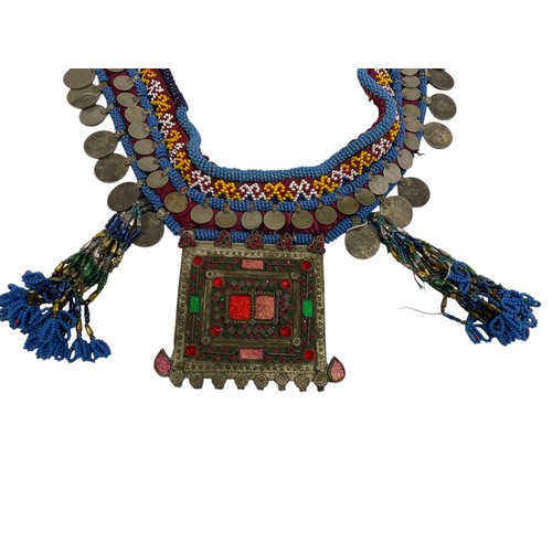 307 - Kuchi beaded & tasseled coin necklace, the large pendant with jewelled effect detail