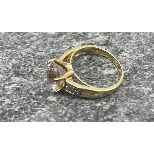 61 - 9ct gold cluster ring, a central pale stone within a ring of smaller white stones, size N; a CZ soli...