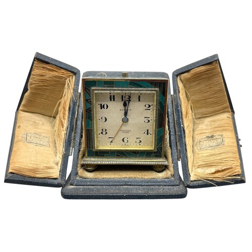 216 - Zenith Art Deco travelling alarm clock in gilt brass rectangular case with enamelled geometric desig... 