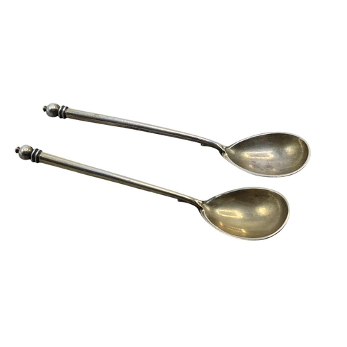 135 - Good quality pair of Russian gilt neillo silver teaspoons, decorated with the Kremlin, maker Mikhail... 