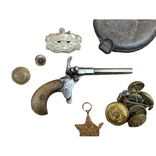 223 - Mixed assortment of military and shooting related pieces to include buttons, medals, cap badges, tre... 