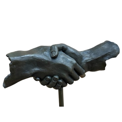 1435 - Contemporary heavy bronze shaking hand sculpture, raised atop veined marble base, H 37cm x W 34cm