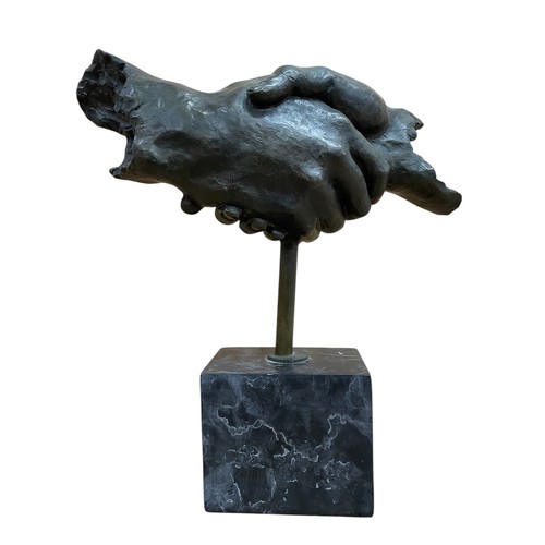 1435 - Contemporary heavy bronze shaking hand sculpture, raised atop veined marble base, H 37cm x W 34cm