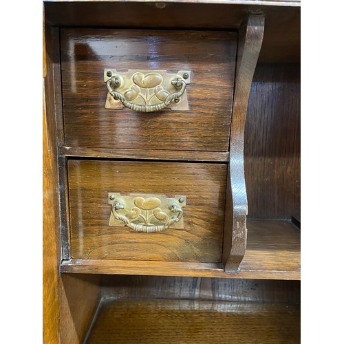 464 - Edwardian oak smokers cabinet, having bevelled glass panes enclosing a fitted twin draw interior ado... 