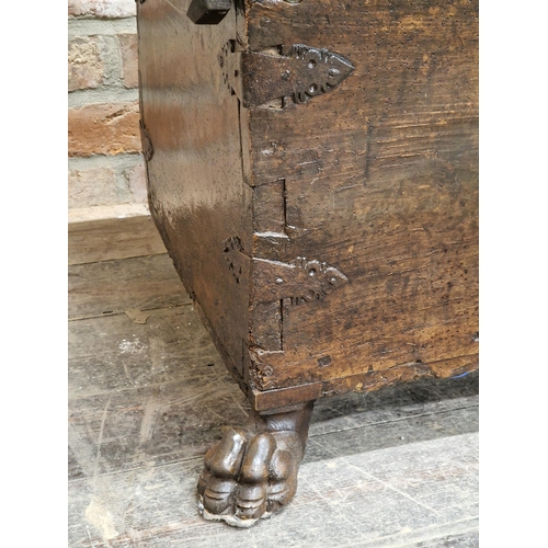 1246 - 16th / 17th century Spanish fruitwood coffer, with iron strapwork and lion paw feet, H 45cm W 155cm ... 