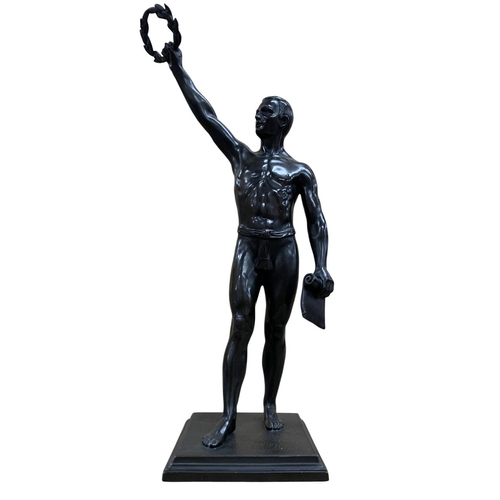 535 - Large spelter sculpture of Olympic salute, depicting competitor holding wreath and scroll, likely fr... 