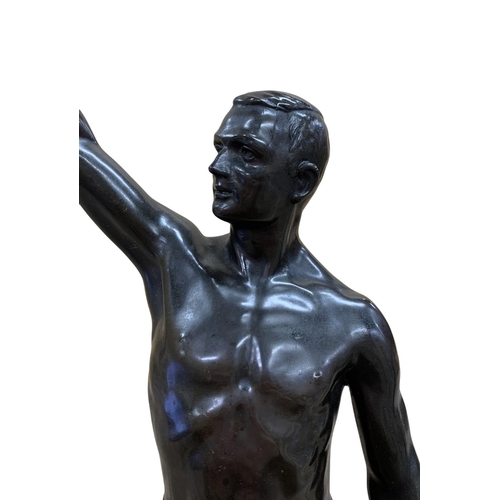 535 - Large spelter sculpture of Olympic salute, depicting competitor holding wreath and scroll, likely fr... 