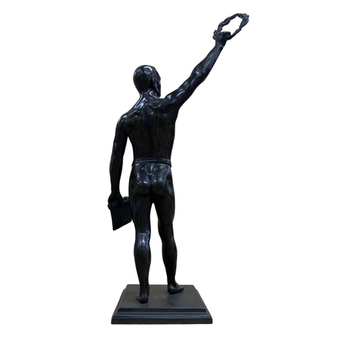 535 - Large spelter sculpture of Olympic salute, depicting competitor holding wreath and scroll, likely fr... 