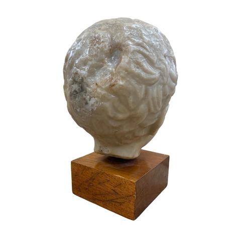 1439 - Hand carved wax head sculpture of young boy, having indistinct mark to verso, likely the artists fir... 