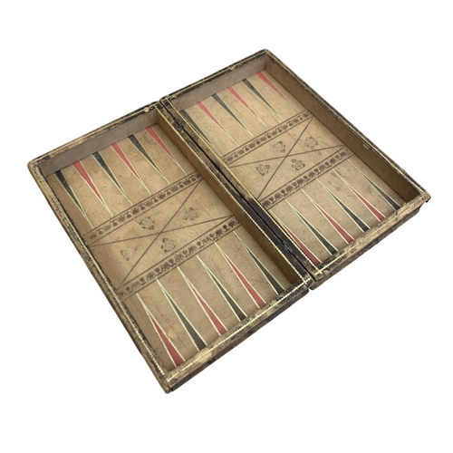 479 - Antique faux book leather wrapped games compendium box, having chess board exterior and backgammon i... 