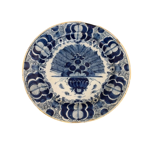 394 - Three 18th century Delft blue and white peacock pattern chargers, D 35cm (3)