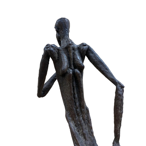 1440 - Unusual figurative iron sculpture of running nude man, atop heavy metal rectangular base, signed and... 