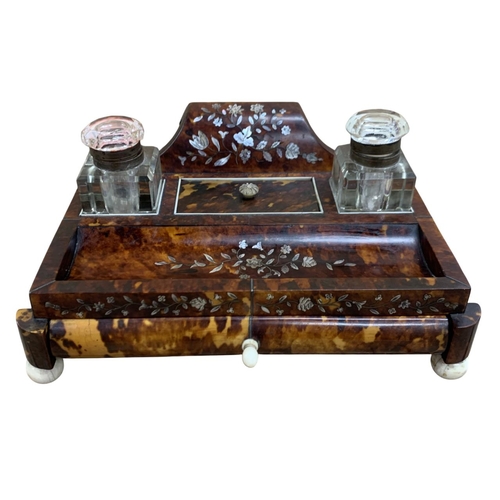 178 - 19th century tortoise shell desk standish raised atop four bone feet, with floral mother of pearl in... 