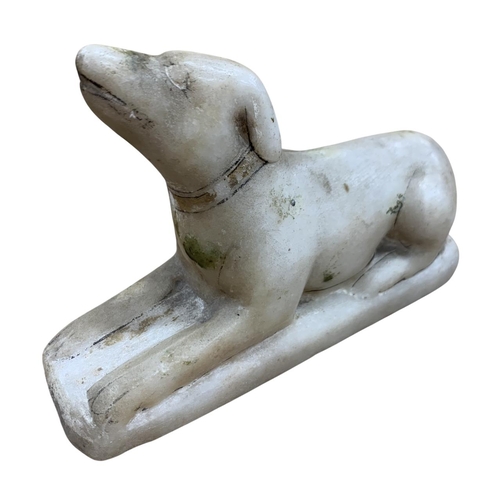 172 - Early hand carved alabaster recumbent hound figure, showing sign of original paintwork, possibly 17t... 