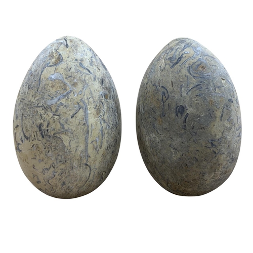 268 - Pair of Grand Tour hand carved granite eggs, H 15cm