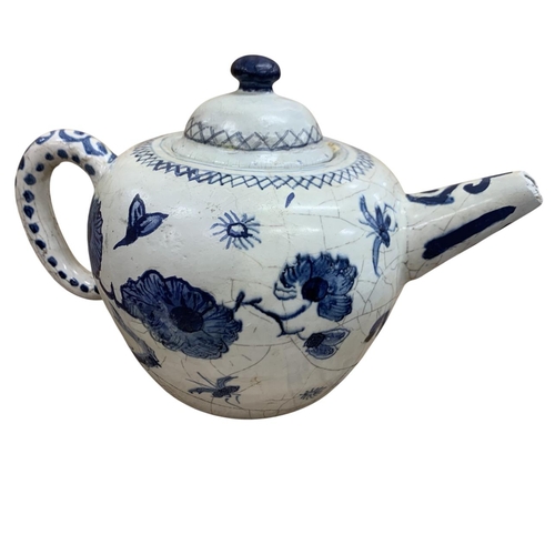 404 - Two 18th century Delft floral pattern teapots with a further hand painted blue and white English Del... 