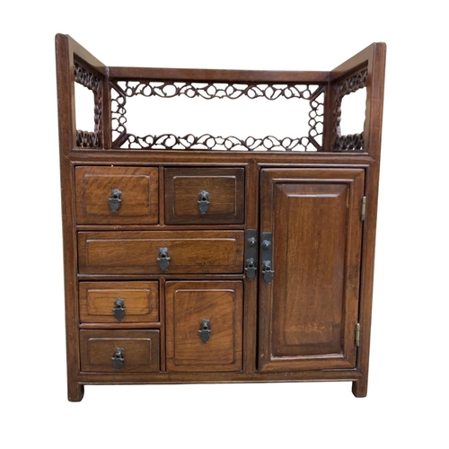 315 - Hand carved Chinese hardwood Qing Dynasty table cabinet, having six draw and single door frontage, s... 