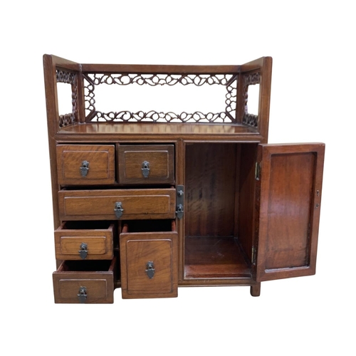 315 - Hand carved Chinese hardwood Qing Dynasty table cabinet, having six draw and single door frontage, s... 