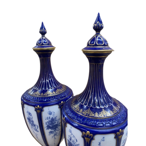 425 - Pair of exceptional Royal Worcester lidded vases, having cobalt blue and white colourway with gold g... 